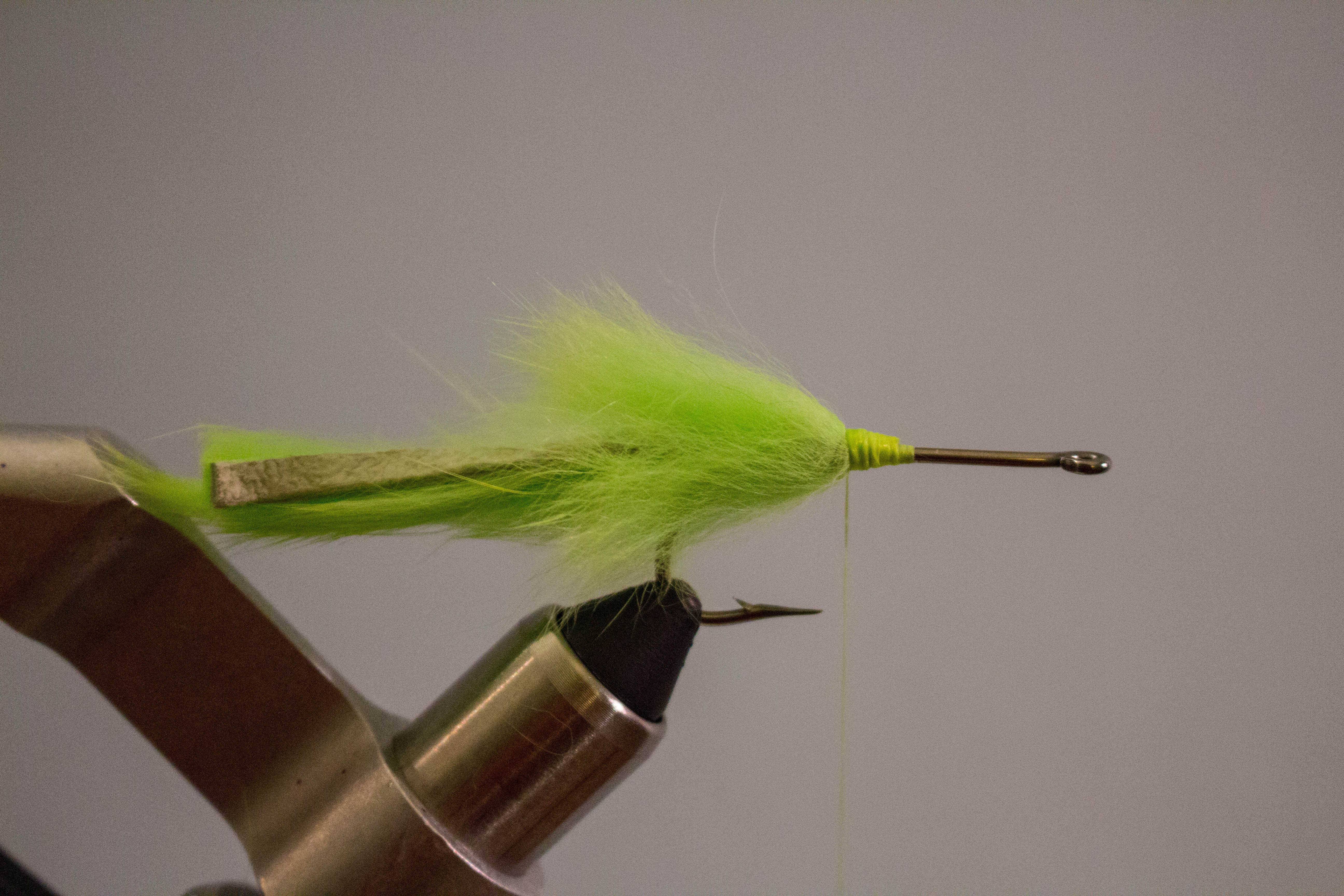 Tarpon Bunny - Step 5: Tie in a cross-cut rabbit stripin front of the tail and wra…